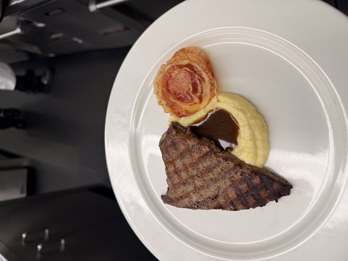 Grilled steak with mashed potato and tomato tart