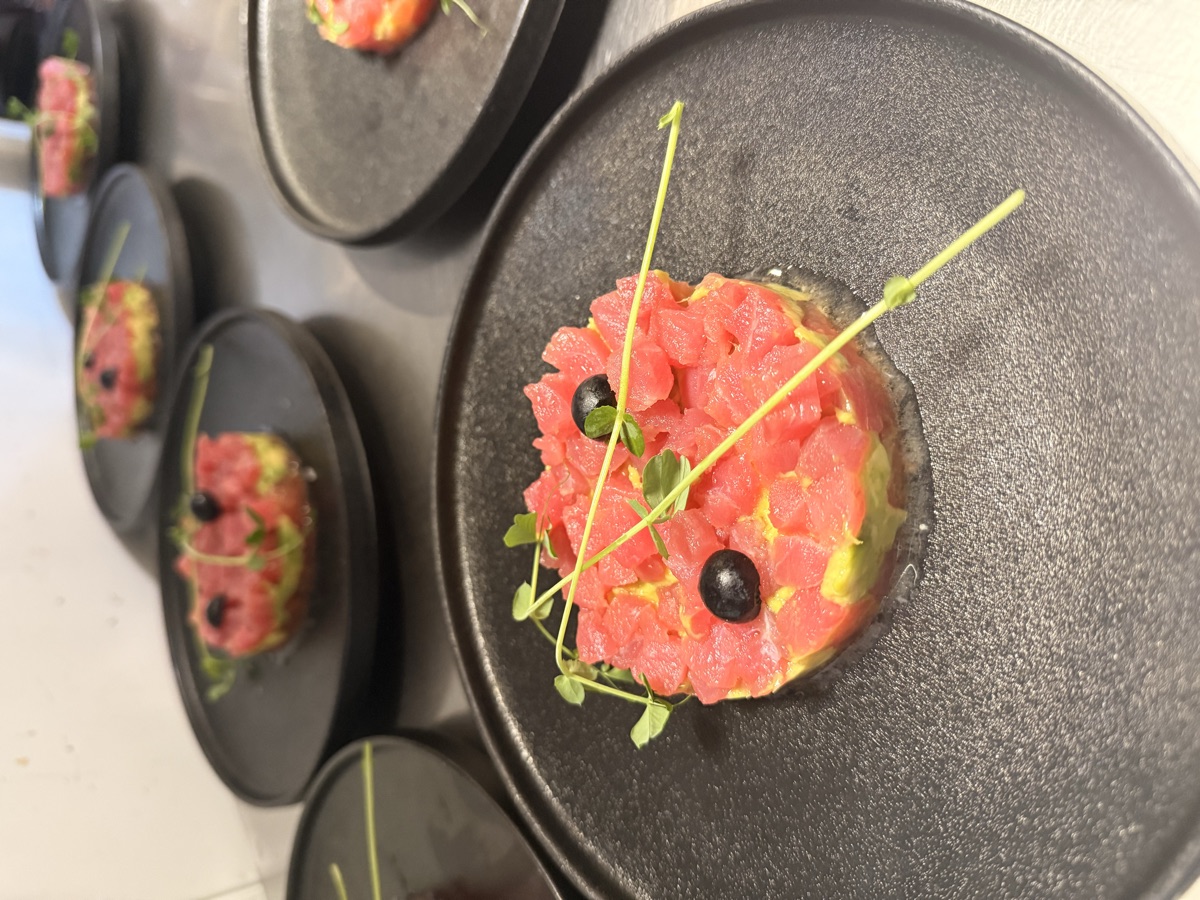 Multiple tuna tartare plates lined up — event catering service