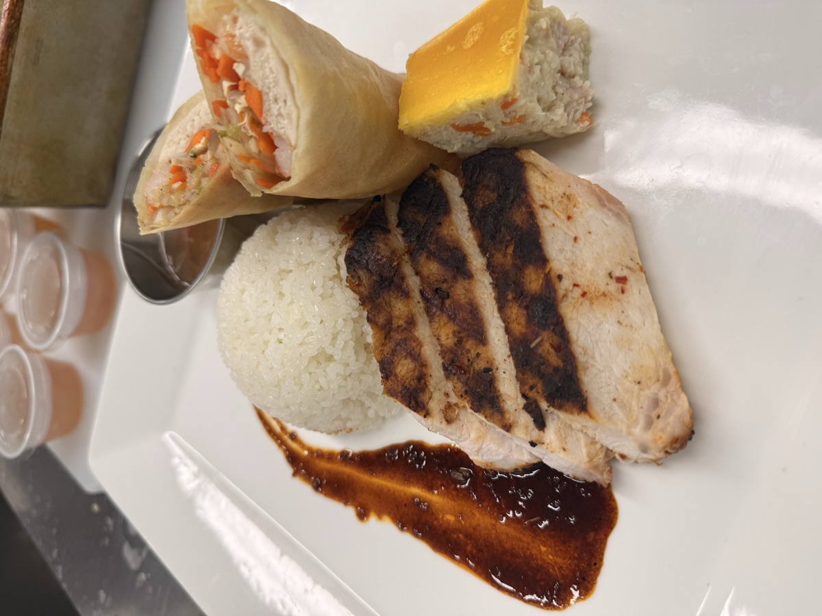 Grilled chicken plate with jasmine rice and spring rolls